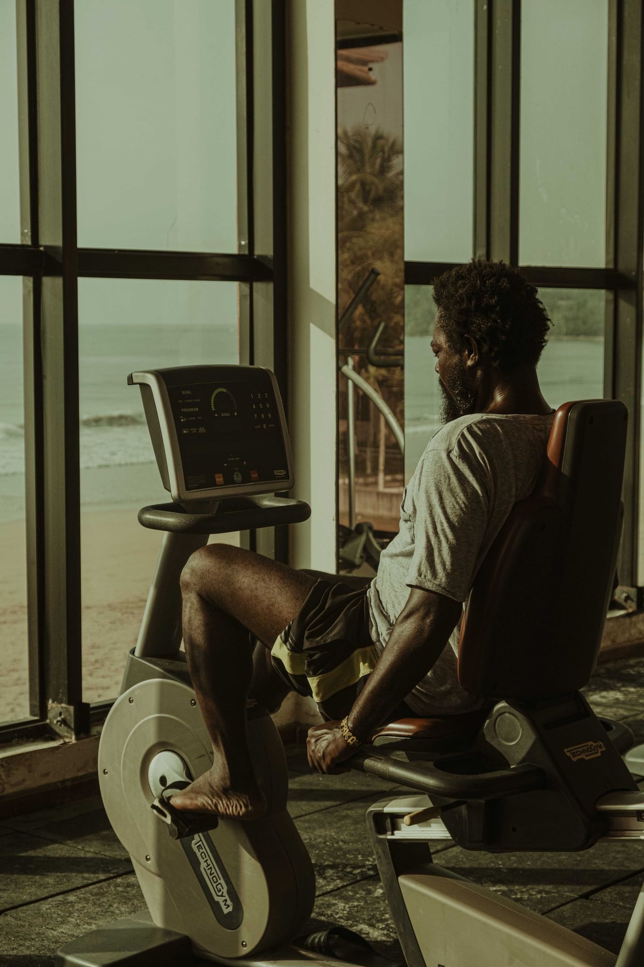 Member on an exercise bike in a gym